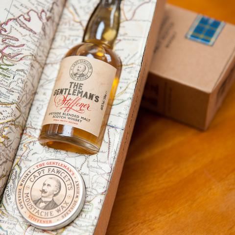 Set regalo di cera di baffi e bottiglia di whisky